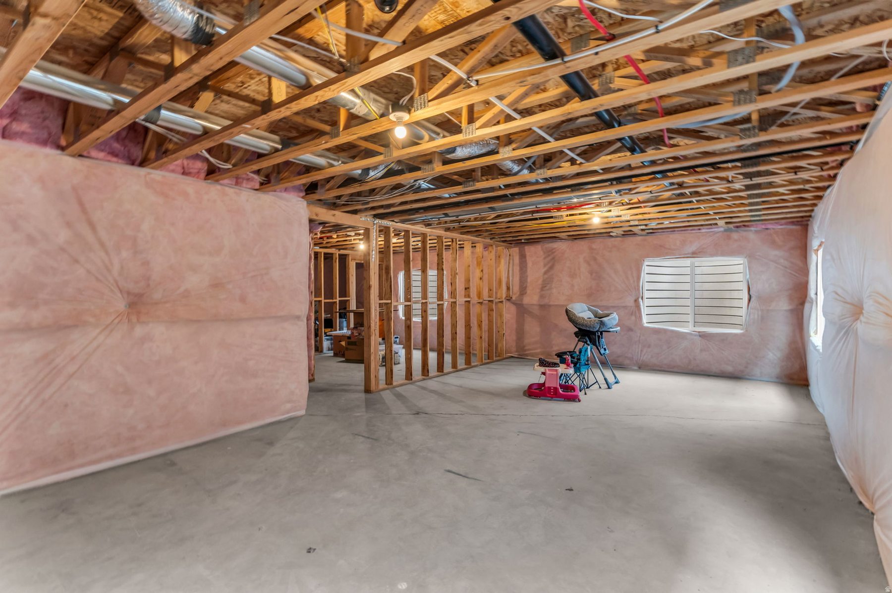 Unfinished basement at 1243 S 1040 E Heber City — framed insulated 1048 sq ft ready to finish