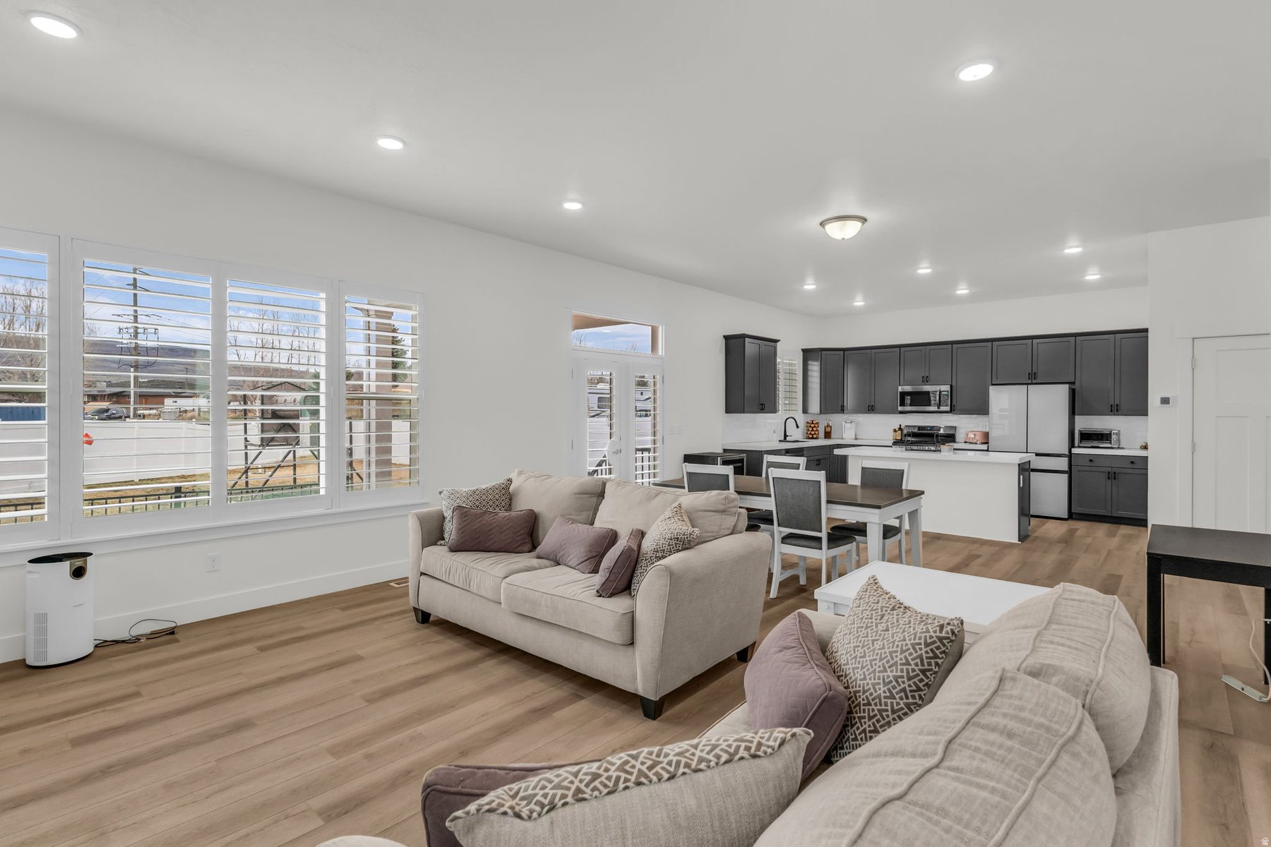 Open concept living and kitchen at 1243 S 1040 E Heber City with hardwood floors and mountain views